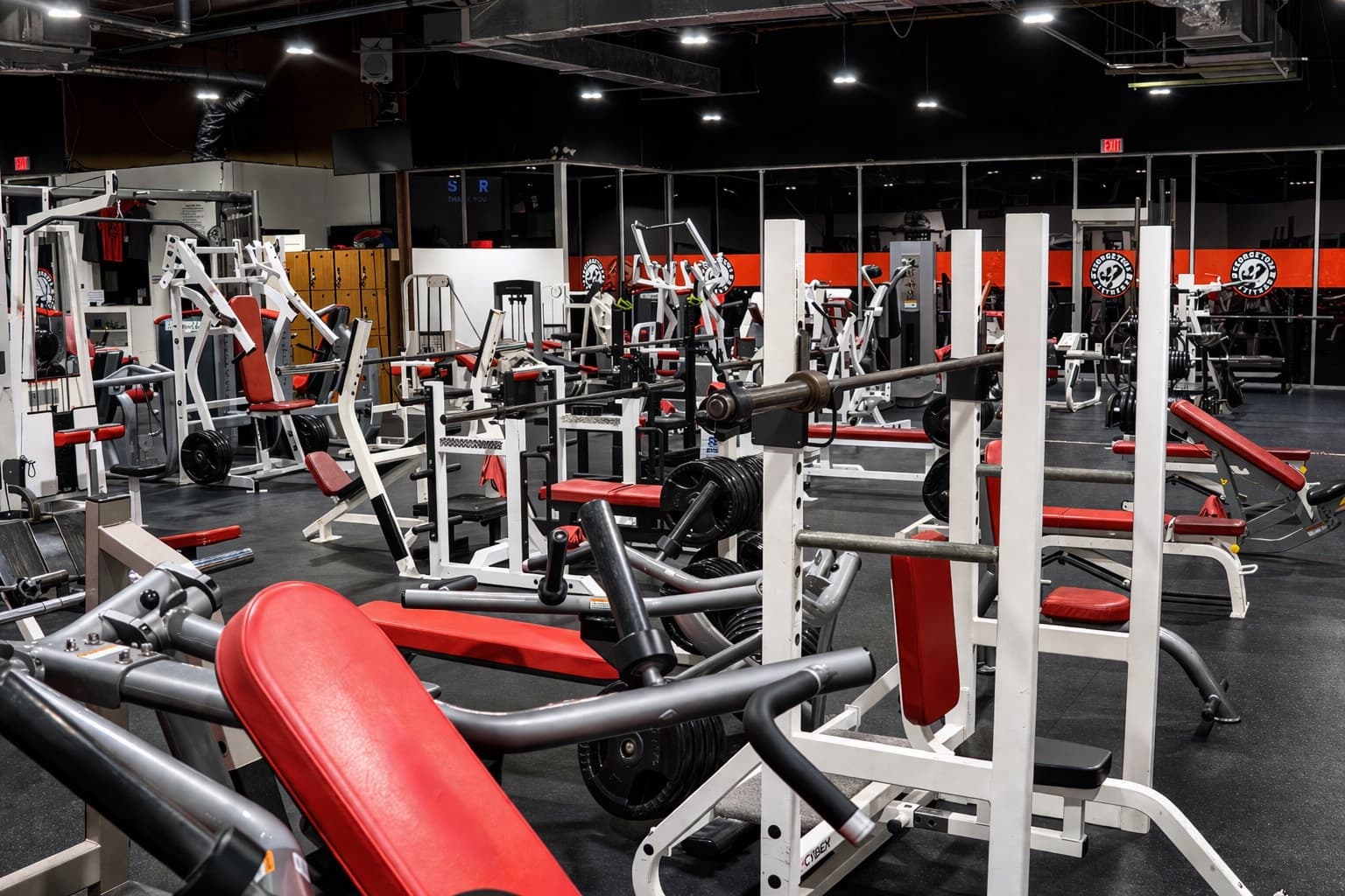 Red and white strength equipment at Georgetown Fitness