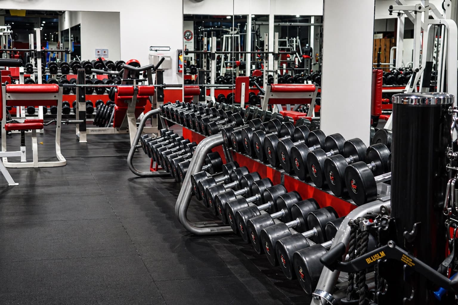 Strength training machines arranged across the gym