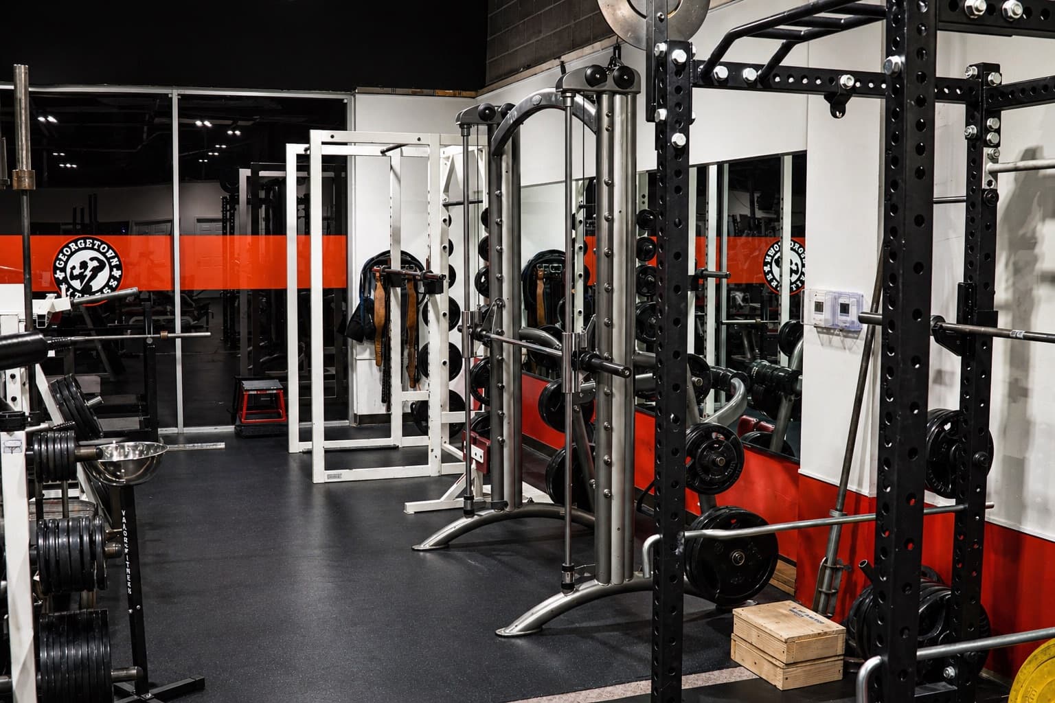 Gym floor with cables, benches, and strength machines