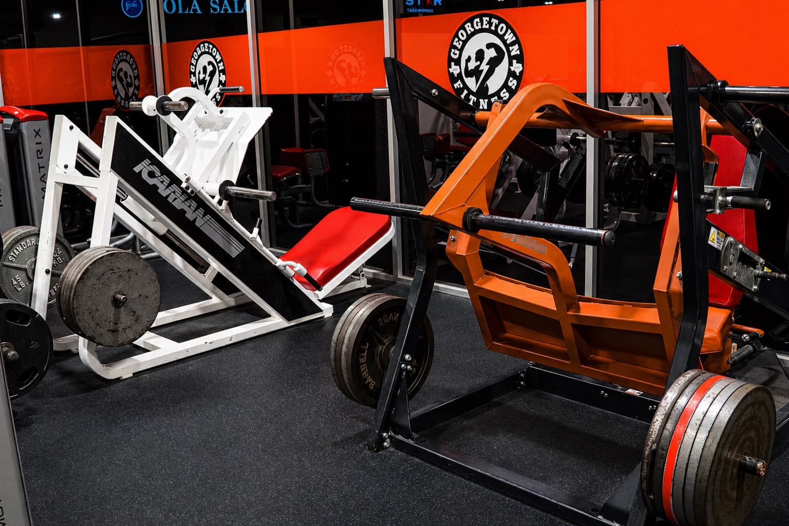 Weight machines and gym mirrors inside Georgetown Fitness