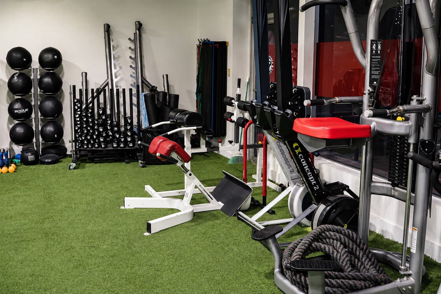 Red strength equipment and cable machines in the facility